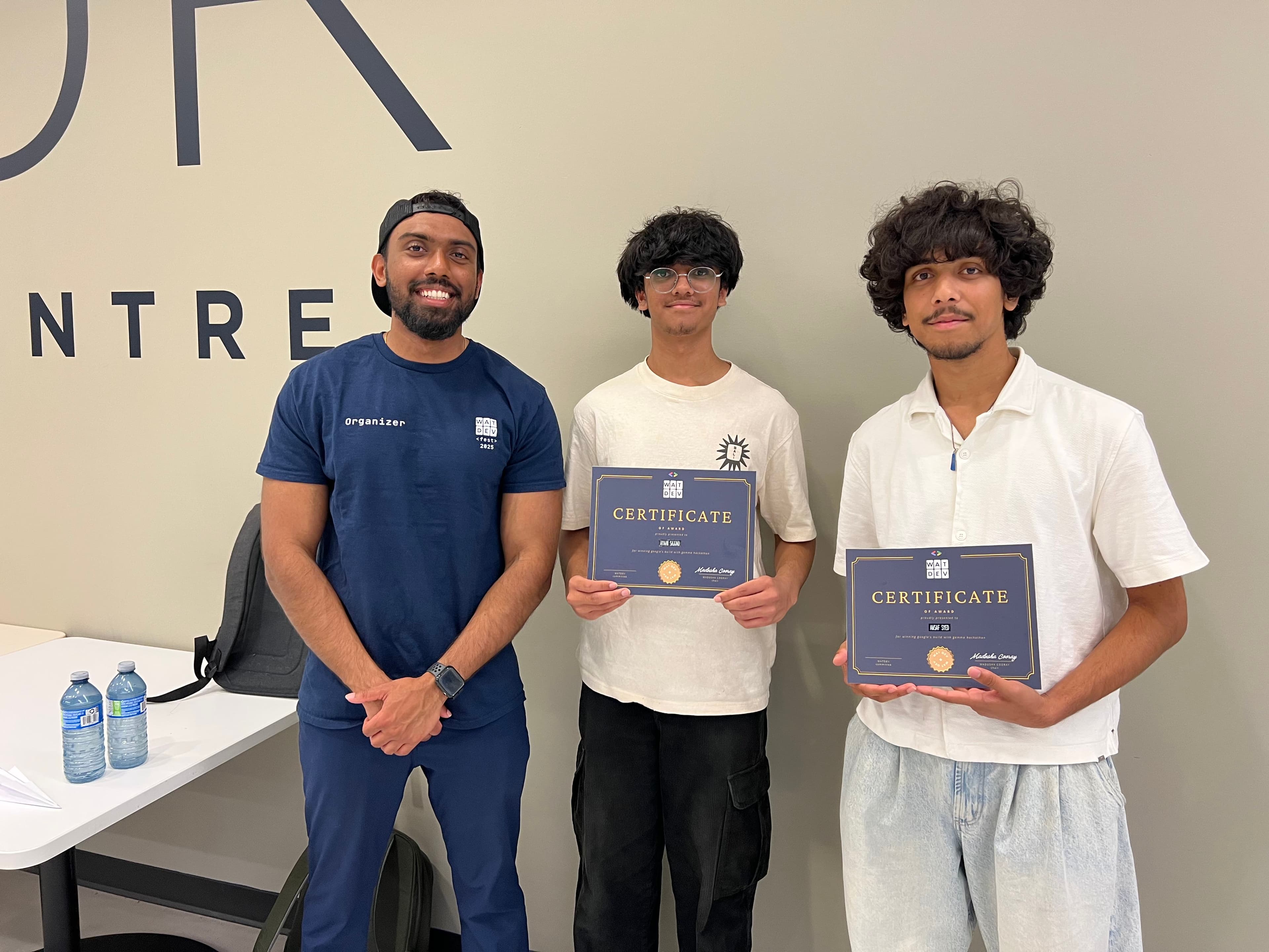 Our team with our certificate standing next to an event organizer